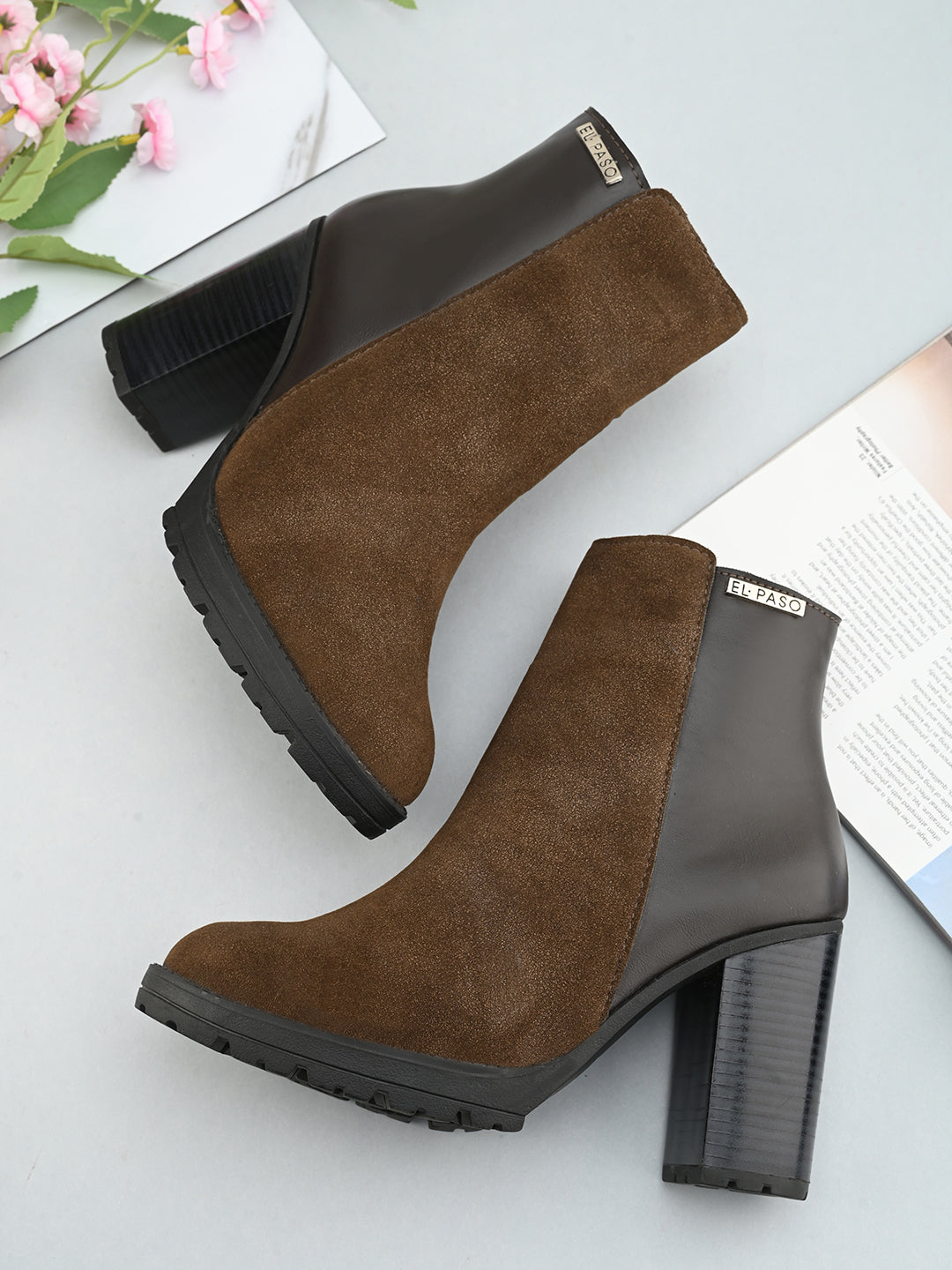 Brown suede ankle boots with a block heel, plus mid-top leather slip-on boots for versatile style and comfort.