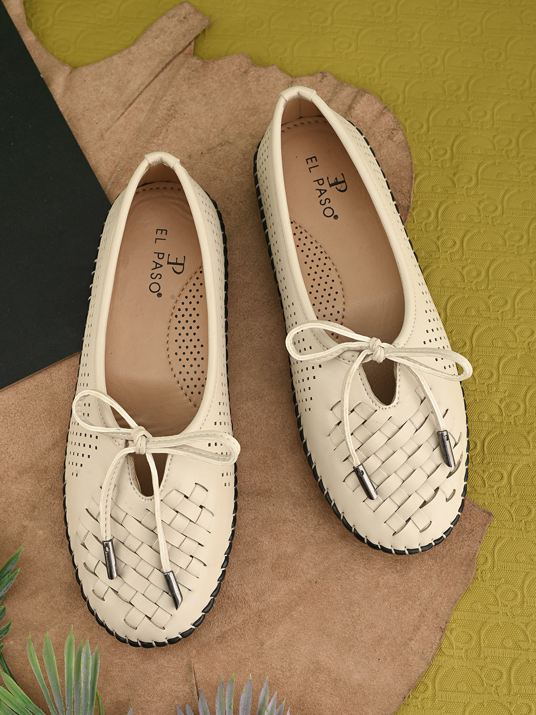 A beige Women Bows Ballerina Flats with a perforated and woven upper, round toe, metallic-tipped bow detail, and a flexible black rubber outsole for comfort and casual wear.