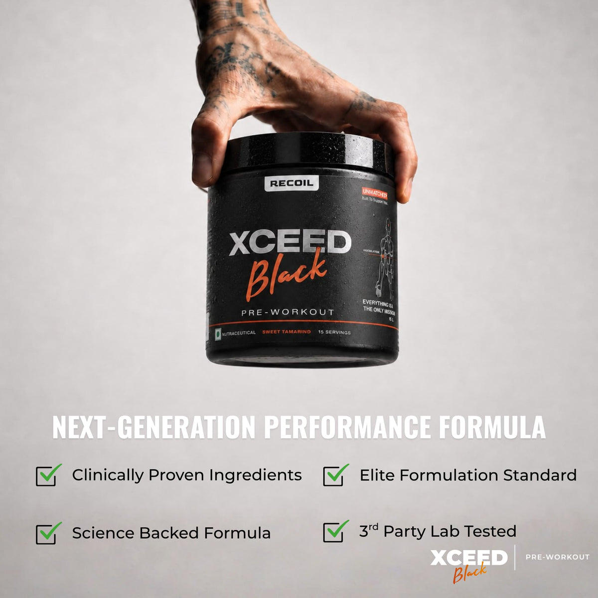 A hand with tattoos holds a black tub of RECOIL XCEED Black pre-workout against a light gray background, with marketing text below highlighting clinically proven ingredients, elite formulation, science-backed formula, and third-party lab testing.