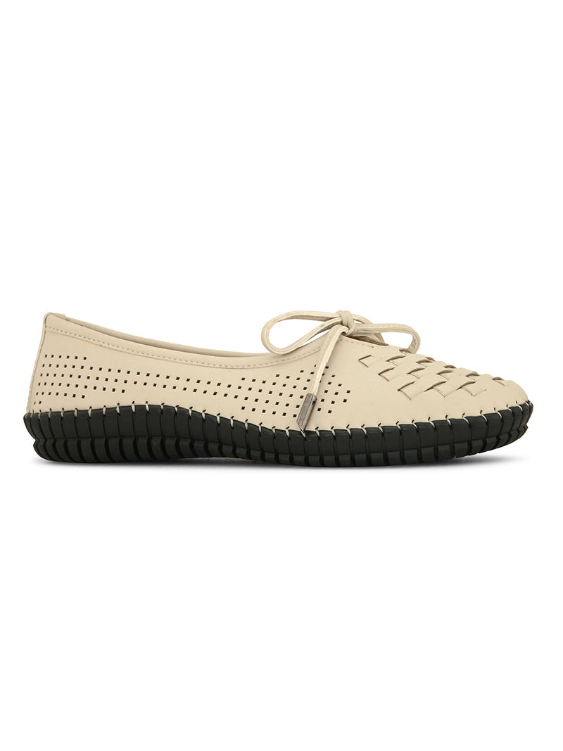 A beige women's flat with a perforated woven upper, round toe, metallic-tipped bow, and flexible black rubber outsole for comfort and casual wear.