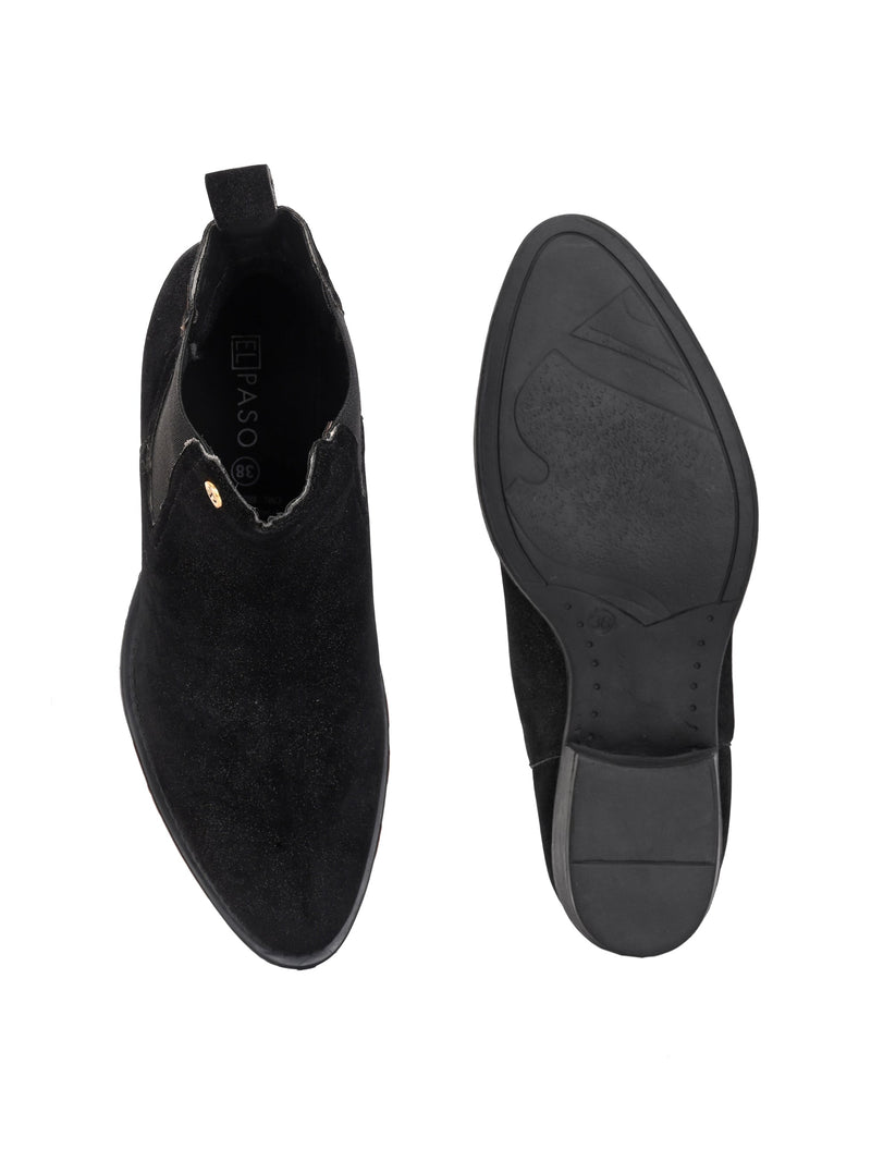 Charcoal suede slip-on boots with elastic side panels and a low block heel, featuring subtle gold detailing for a sleek, versatile look
