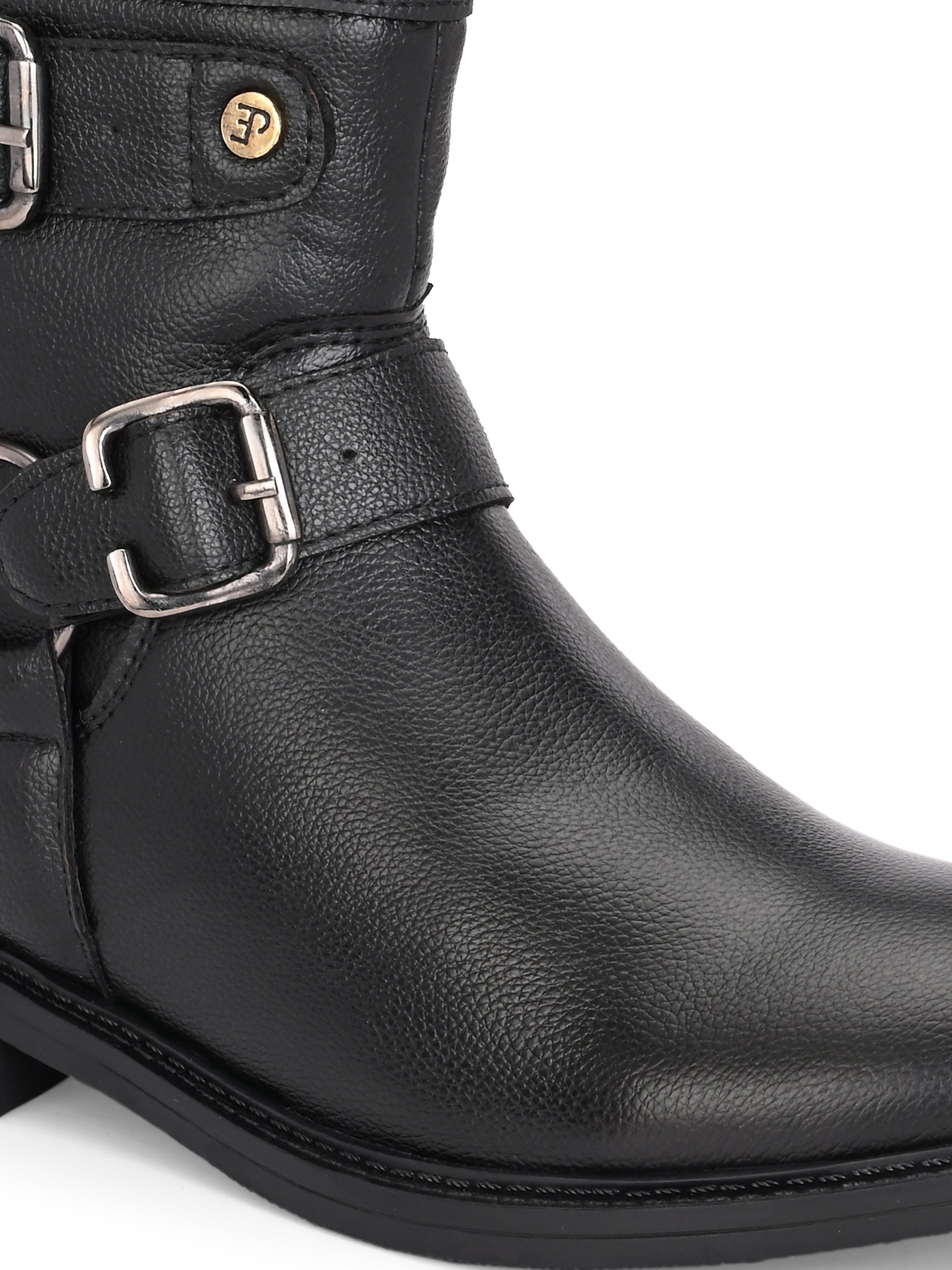 Black boots with silver buckle accents and a low heel, perfect for casual or semi-formal wear.
