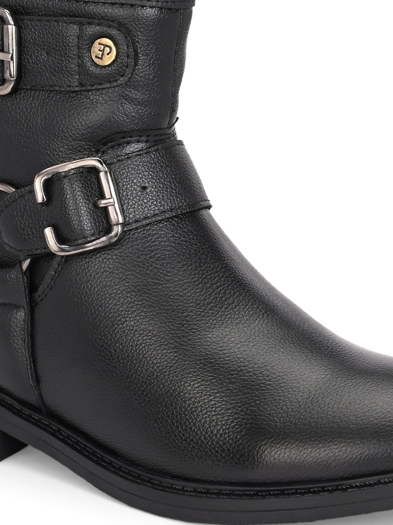 Black boots with silver buckle accents and a low heel, perfect for casual or semi-formal wear.