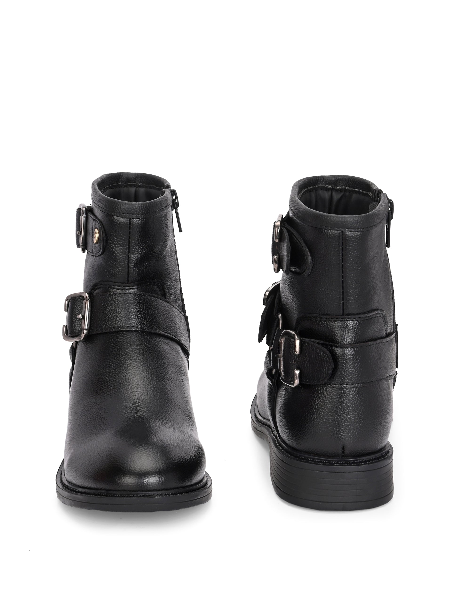Black boots with silver buckle accents and a low heel, perfect for casual or semi-formal wear.