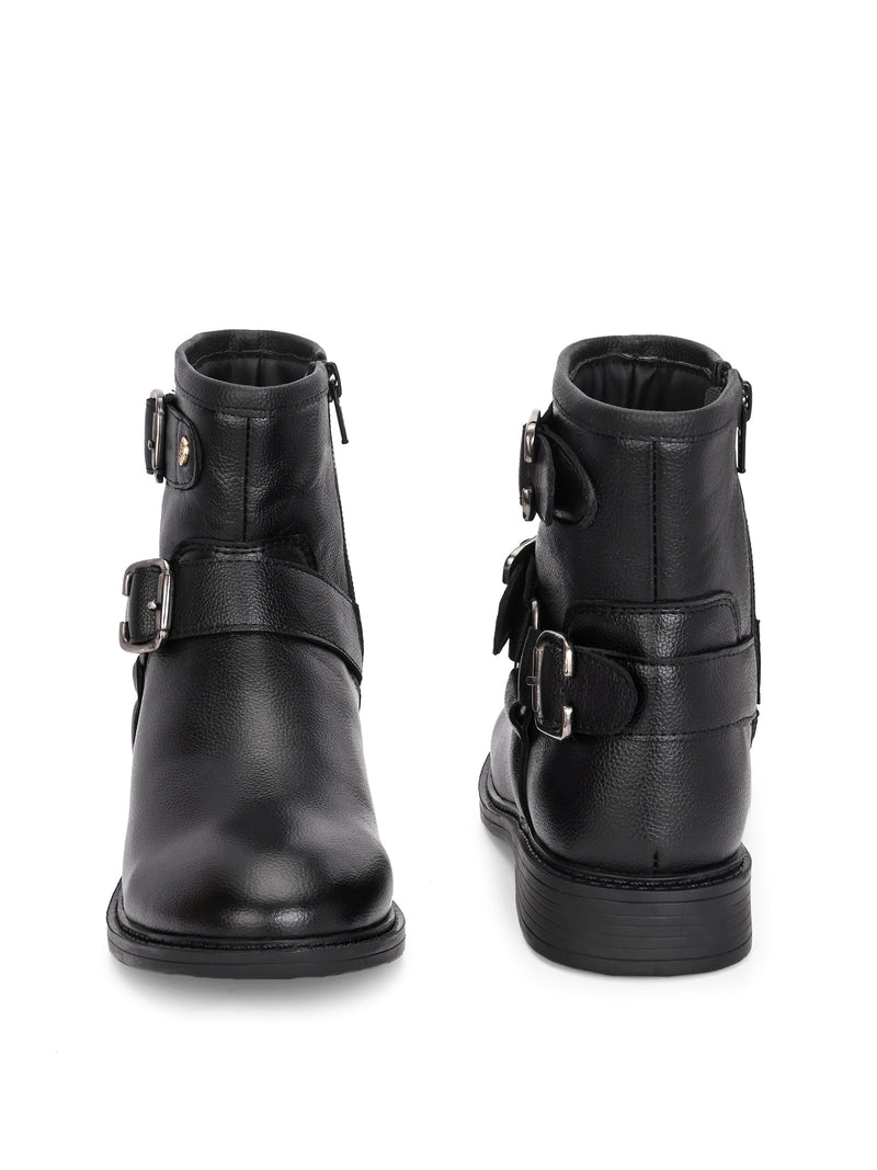 Black boots with silver buckle accents and a low heel, perfect for casual or semi-formal wear.