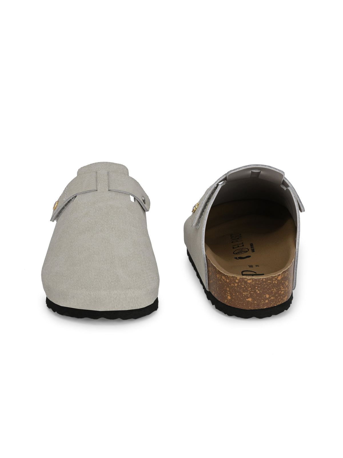 Nude suede slip-on clog with a black rubber sole and adjustable strap.