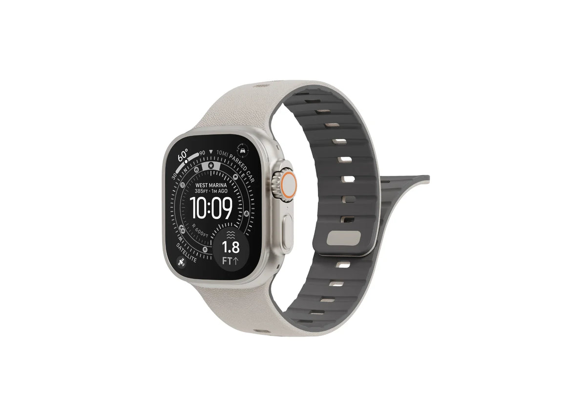 Back view of cream SnapBand silicone Apple Watch strap showing the grey inner lining, ventilation slots and secure magnetic pin closure