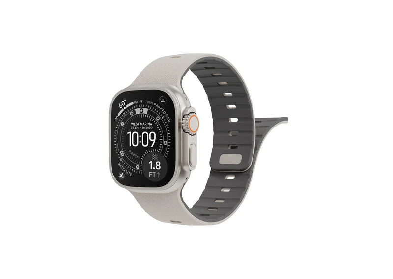 Back view of cream SnapBand silicone Apple Watch strap showing the grey inner lining, ventilation slots and secure magnetic pin closure