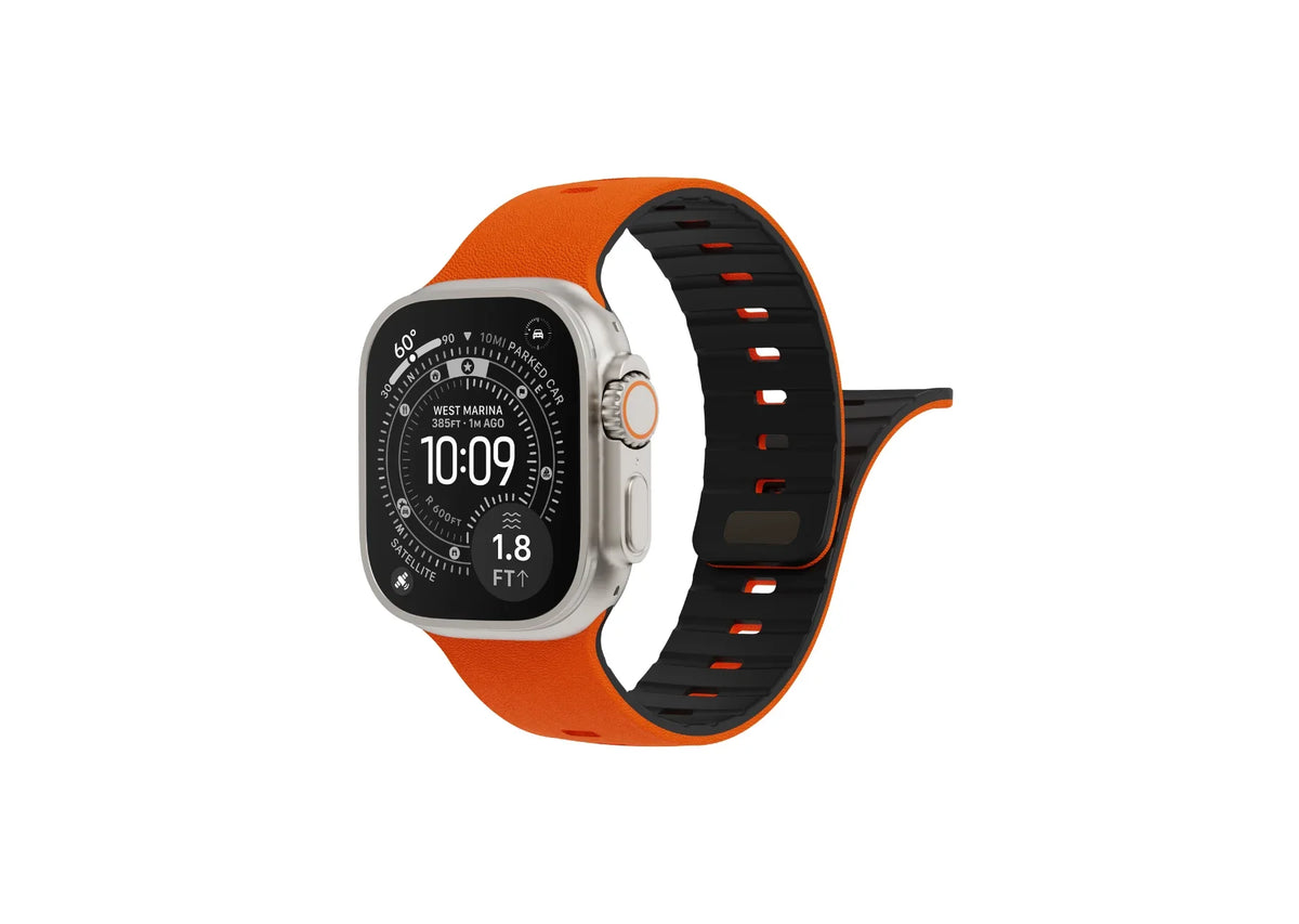 Back view of orange SnapBand silicone Apple Watch strap showing the black inner lining, ventilation slots and secure magnetic pin closure