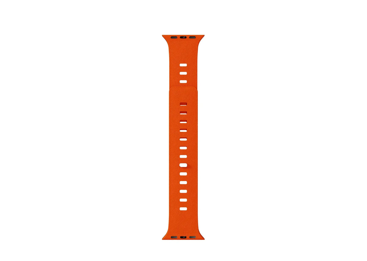 Orange SnapBand Apple Watch strap showing the leather-textured silicone exterior and integrated magnetic pin closure