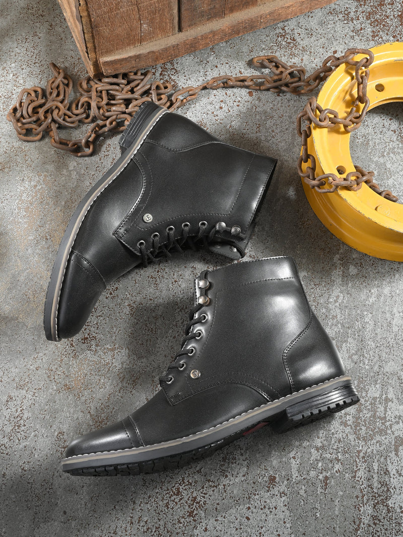 Men's black leather lace-up block-heeled boots with metal eyelets, stitched detailing, and a low heel.