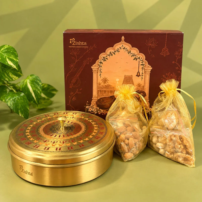 Handcrafted brass dry fruit box with Worli art lid and pouches of almonds, cashews and walnuts, a Diwali corporate gift