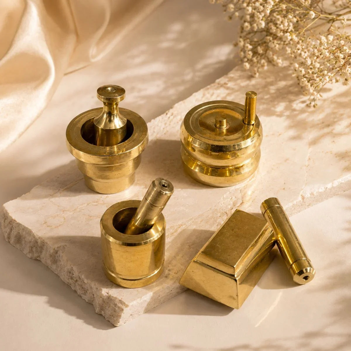 Brass Gowramma Set. Miniature brass grinding tools set – ammi kal, chakki, aattu kal & ural ulakkai on stone slab. Zishta Housewarming Gifts.