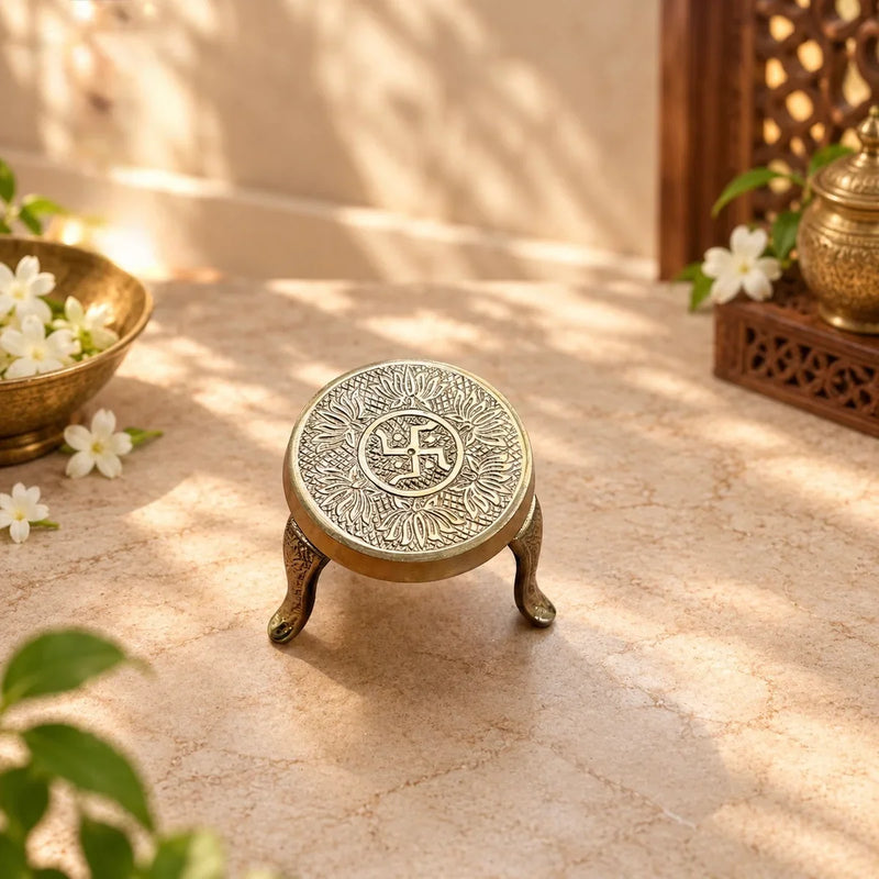 Brass Mukkali Round Small with swastik and lotus engraving, a three-legged pooja stand. Zishta Return Gifts.