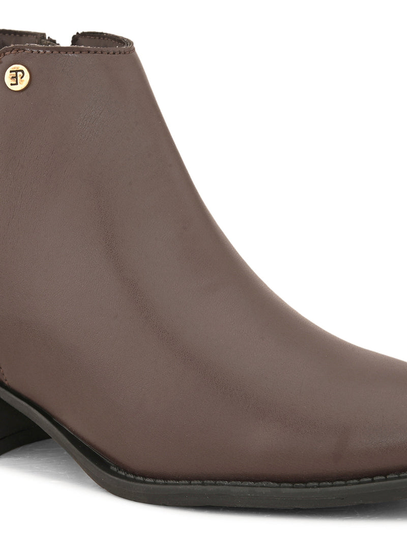 Brown leather boot with a pointed toe, side zipper, and low block heel.