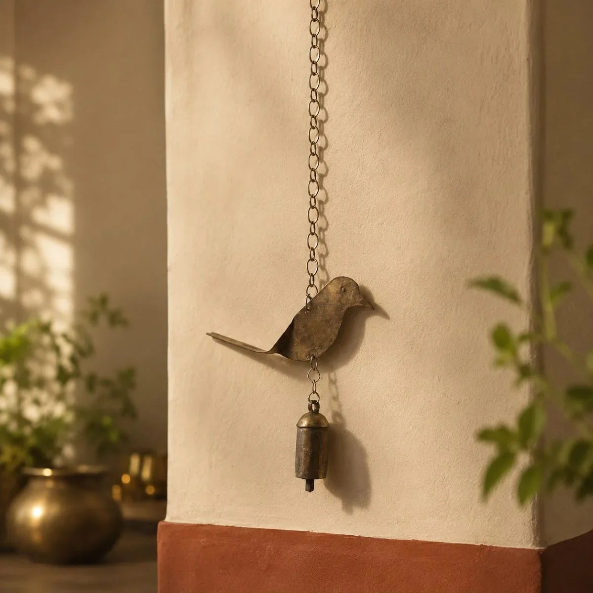 Copper coated iron bird wall hanging bell with chain, handcrafted Kutch metal wall art., close view.  Zishta Traditional Home Decor.
