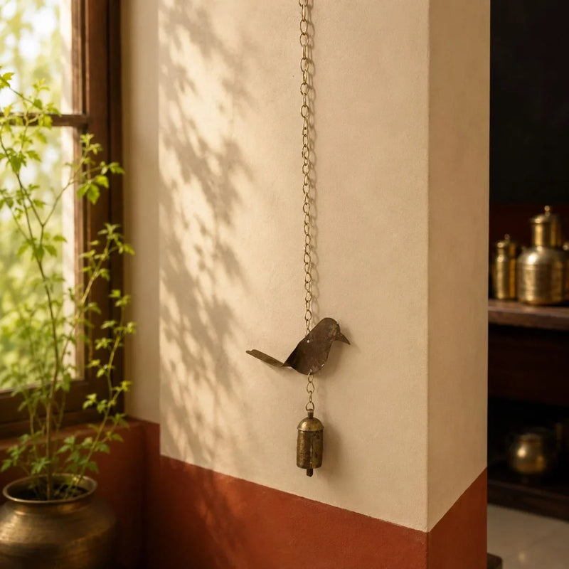 Copper coated iron bird wall hanging bell with chain, handcrafted Kutch metal wall art.  Zishta Traditional Home Decor.