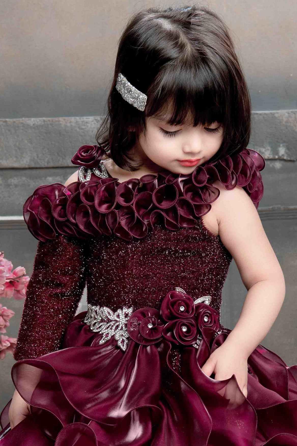 Designer Multilayer Ruffled Maroon Gown With Floral Embellishments For Girls