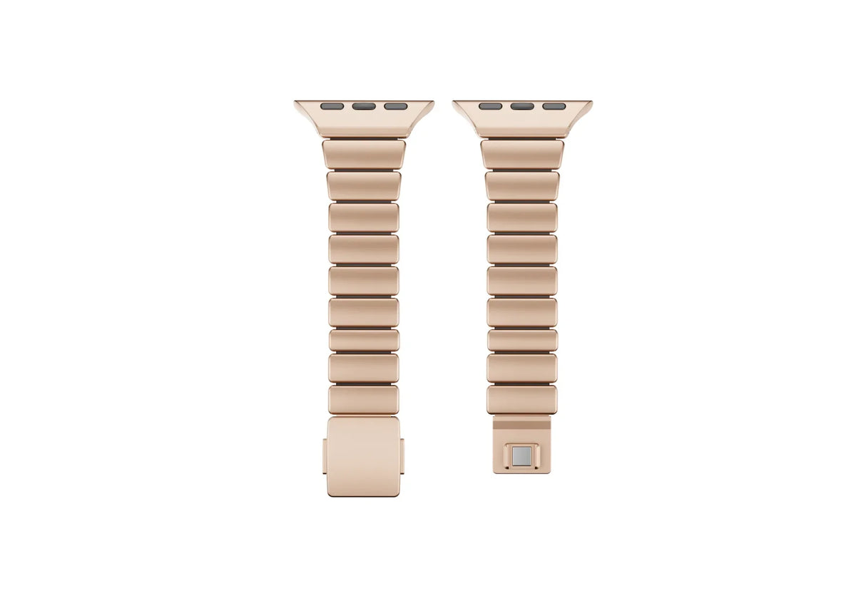 Luxury gold stainless steel Apple Watch band with black silicone inner lining shown partially open, highlighting flexible construction and secure butterfly clasp for Apple Watch Ultra 3, Series 11 and Apple Watch SE.