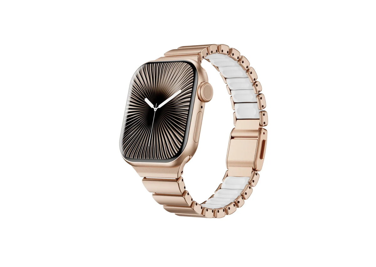 Perspective view of the gold Fusion Apple Watch strap with ivory silicone comfort lining and butterfly clasp shown open, highlighting flexible links and secure locking design for Apple Watch Ultra and Series 11.