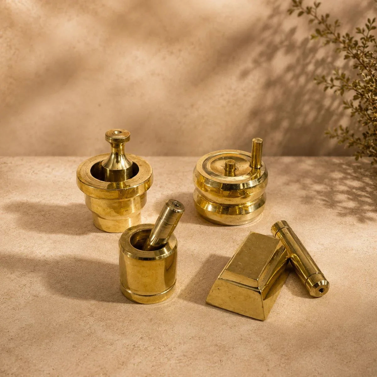 Brass Gowramma Set. Set of 4 miniature brass kitchen grinding tools – ammi kal, chakki, aattu kal, ural ulakkai. ZIshta Housewarming Gifts.