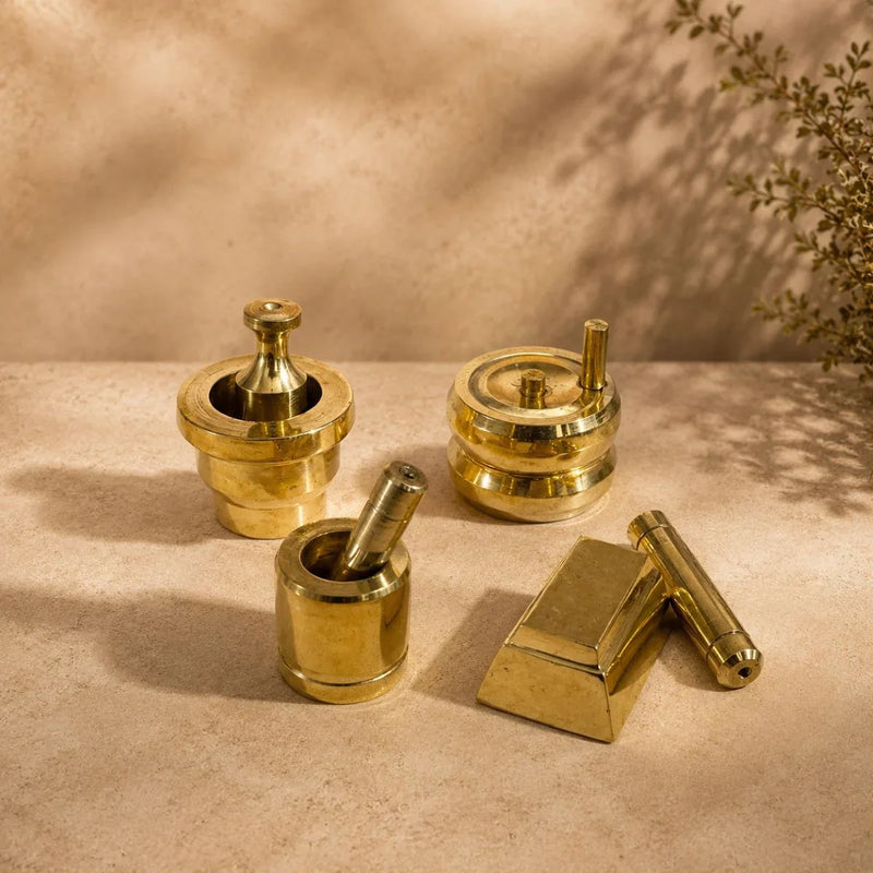 Brass Gowramma Set. Set of 4 miniature brass kitchen grinding tools – ammi kal, chakki, aattu kal, ural ulakkai. ZIshta Housewarming Gifts.