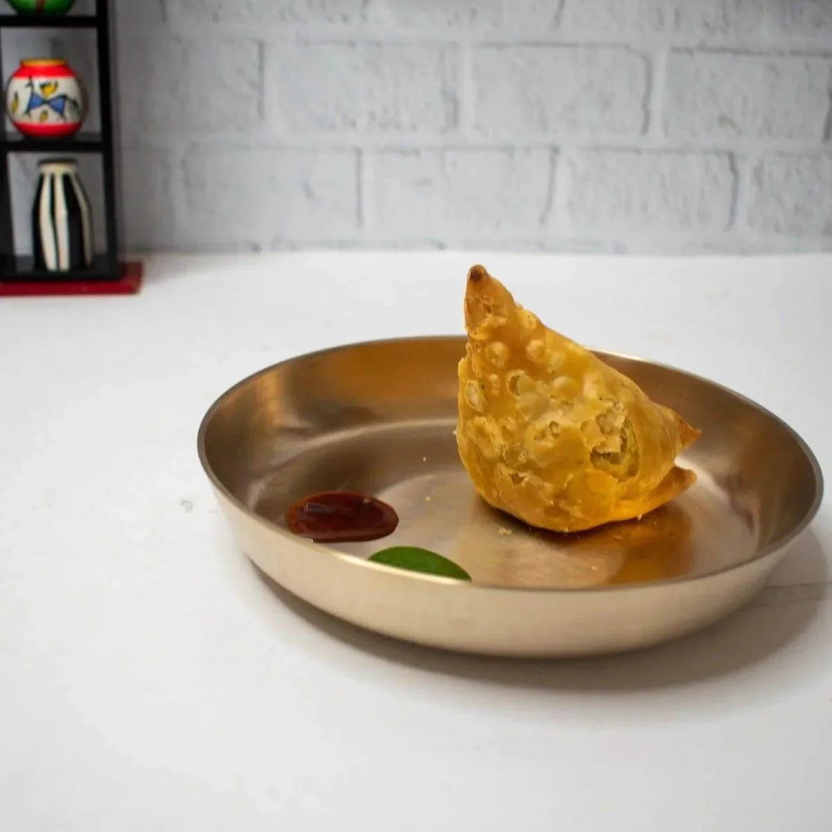 Samosa served in a Kansa Snack Plate-Zishta Traditional  Bronze Serveware
