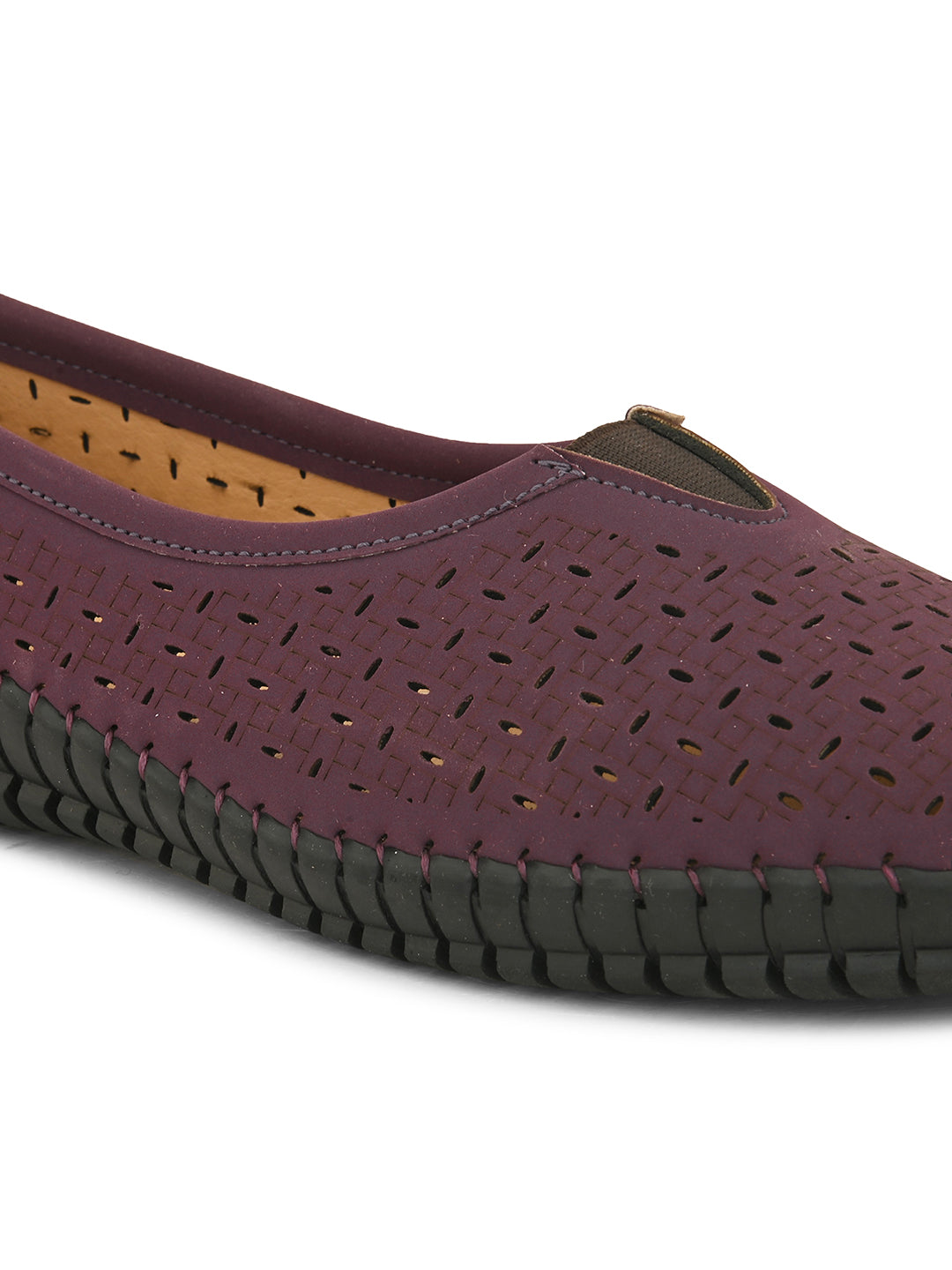 A comfortable maroon slip-on shoe with a perforated design for breathability, featuring a black flexible sole and elastic detailing on the upper for a secure fit.
