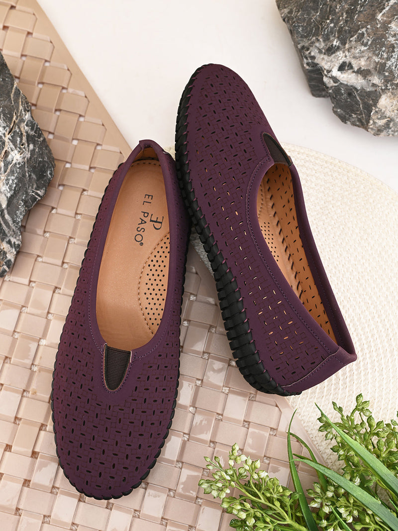 A comfortable maroon Laser-Cut Ballet Flat with a perforated design for breathability, featuring a black flexible sole and elastic detailing on the upper for a secure fit.