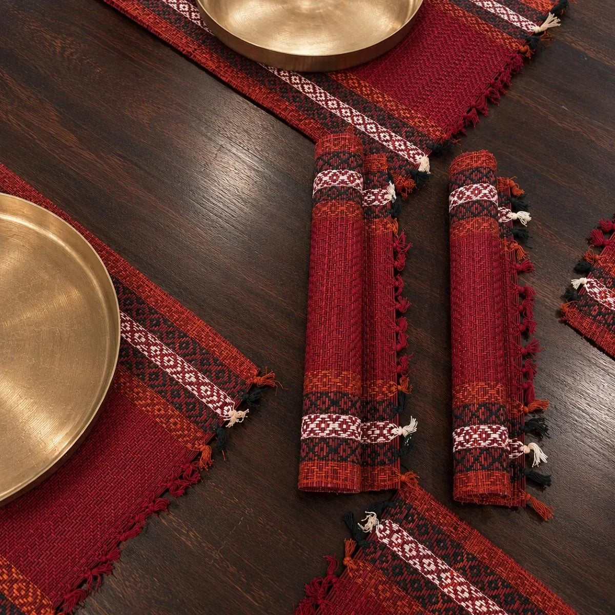 Close-up of madur table mat set sindoor weave with kansa plate. Zishta Home Decor.