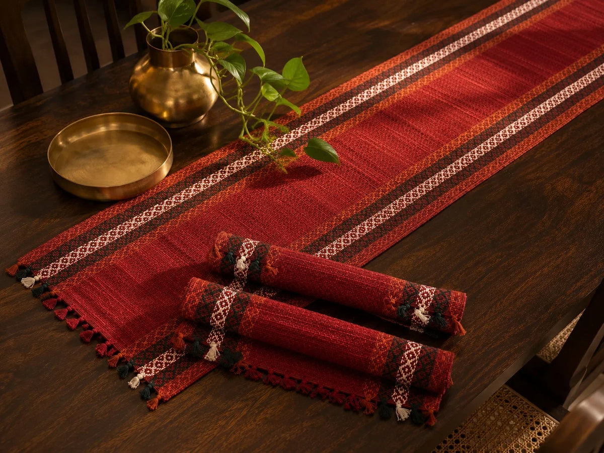 Madur table mat set in sindoor with runner and rolled mats. Zishta Home Decor.