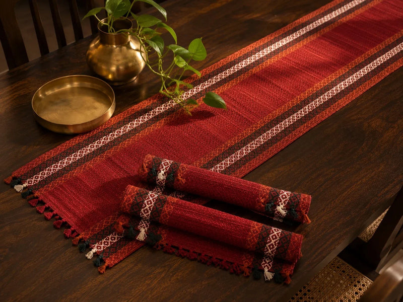Madur table mat set in sindoor with runner and rolled mats. Zishta Home Decor.