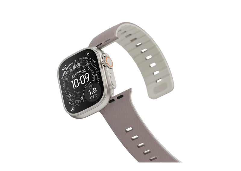 Apple Watch Ultra with Misty Grey & Starlight magnetic silicone strap shown from an angled side view