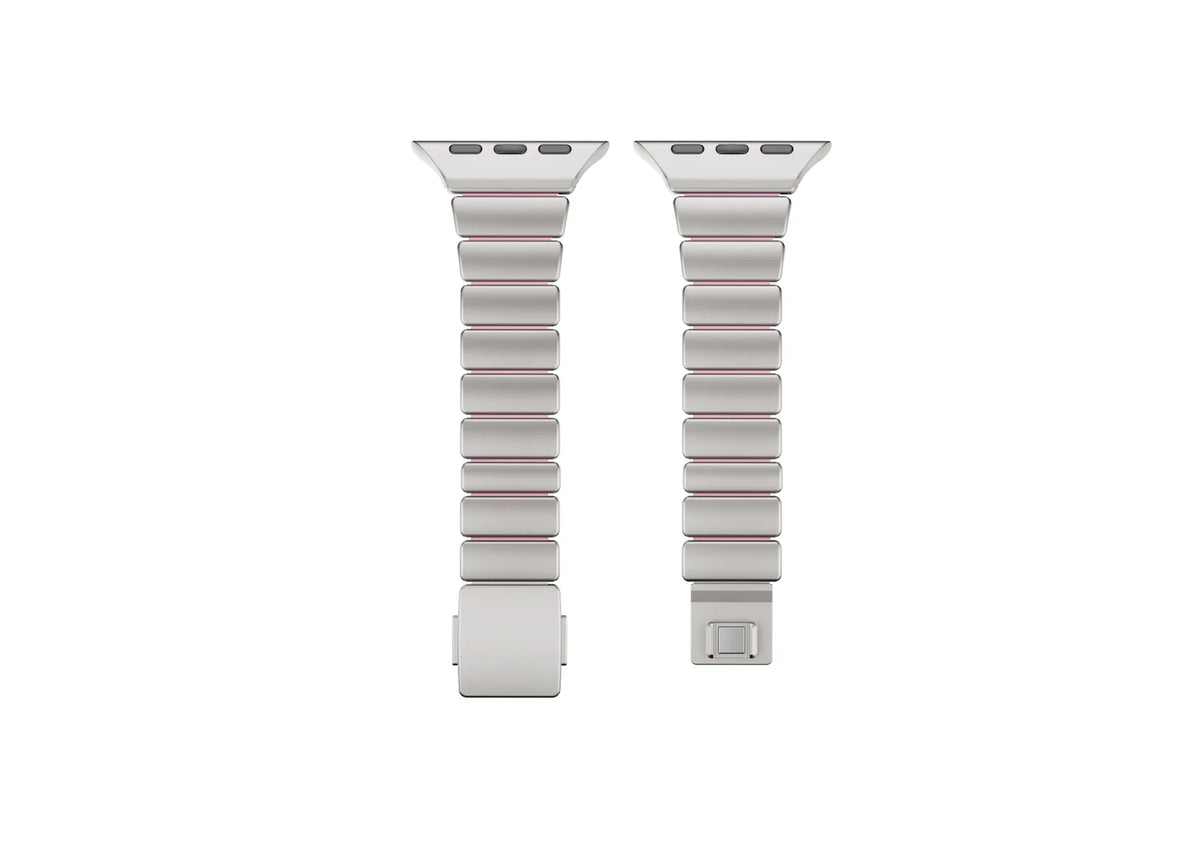 Interior view of the silver stainless steel Apple Watch strap showing soft pink silicone lining for enhanced comfort, sweat resistance and all-day wear with Apple Watch Ultra 3, Series 11, Series 10 and Apple Watch SE.