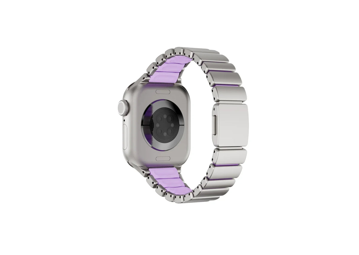Luxury silver and purple Apple Watch band with stainless steel links, silicone comfort lining and folding clasp shown open, designed for women and compatible with Apple Watch Ultra and Series 11.