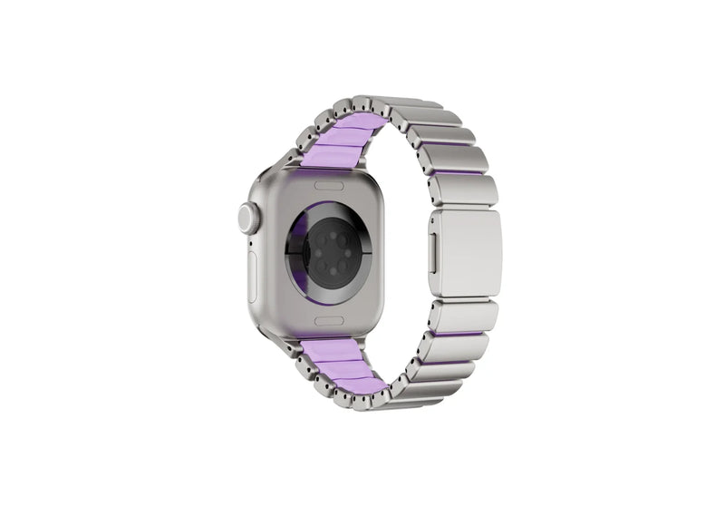 Luxury silver and purple Apple Watch band with stainless steel links, silicone comfort lining and folding clasp shown open, designed for women and compatible with Apple Watch Ultra and Series 11.