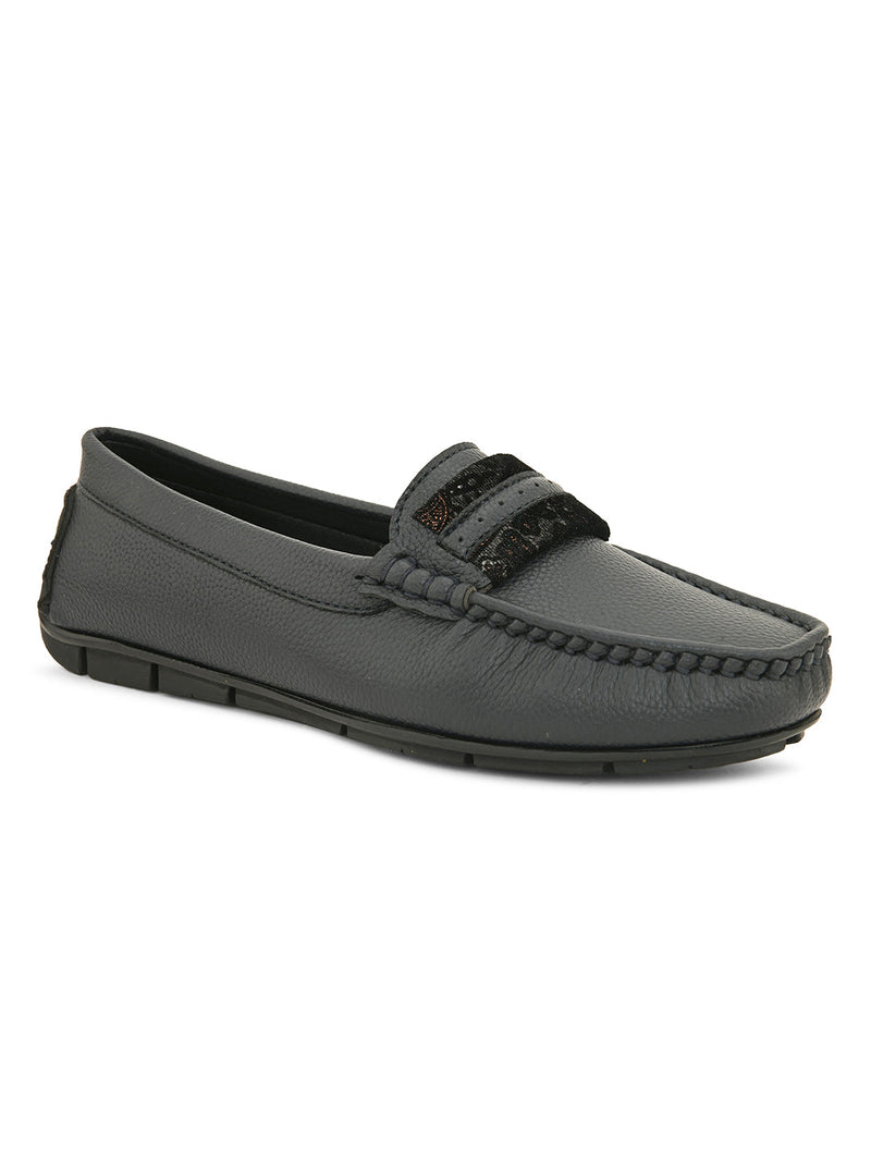 A single dark gray leather loafer with a textured sole and decorative strap across the front.