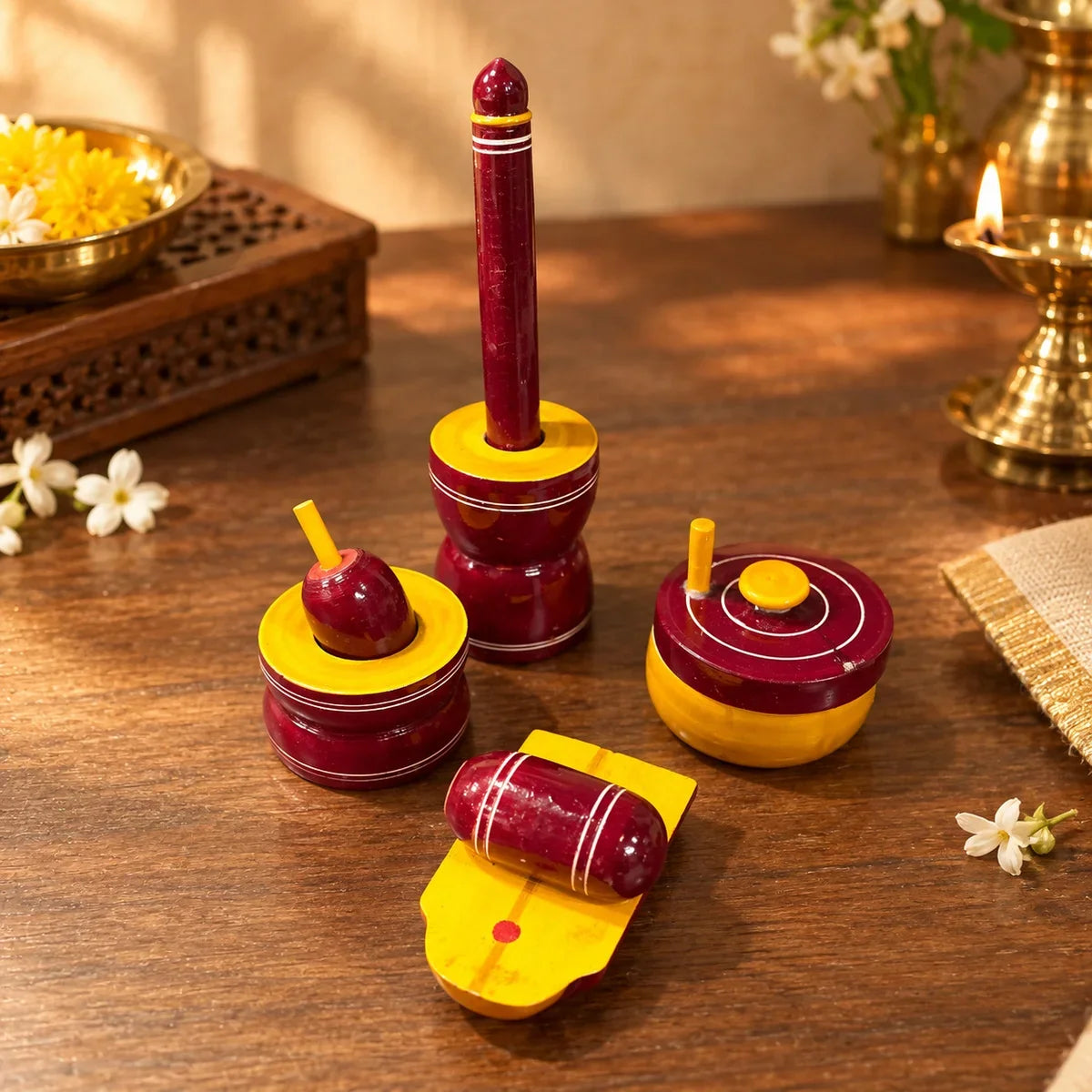 Close-up of Etikoppaka wooden Gowramma set's mortar, pestle, roller grinder and ammi kallu. Zishta Traditional Dolls and Toys.