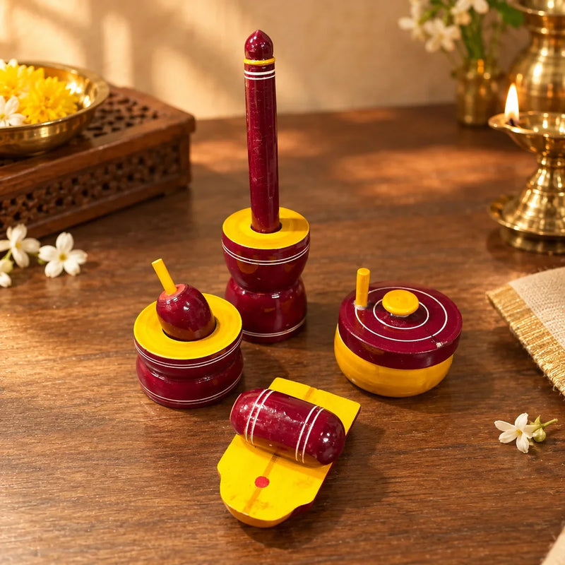 Close-up of Etikoppaka wooden Gowramma set's mortar, pestle, roller grinder and ammi kallu. Zishta Traditional Dolls and Toys.